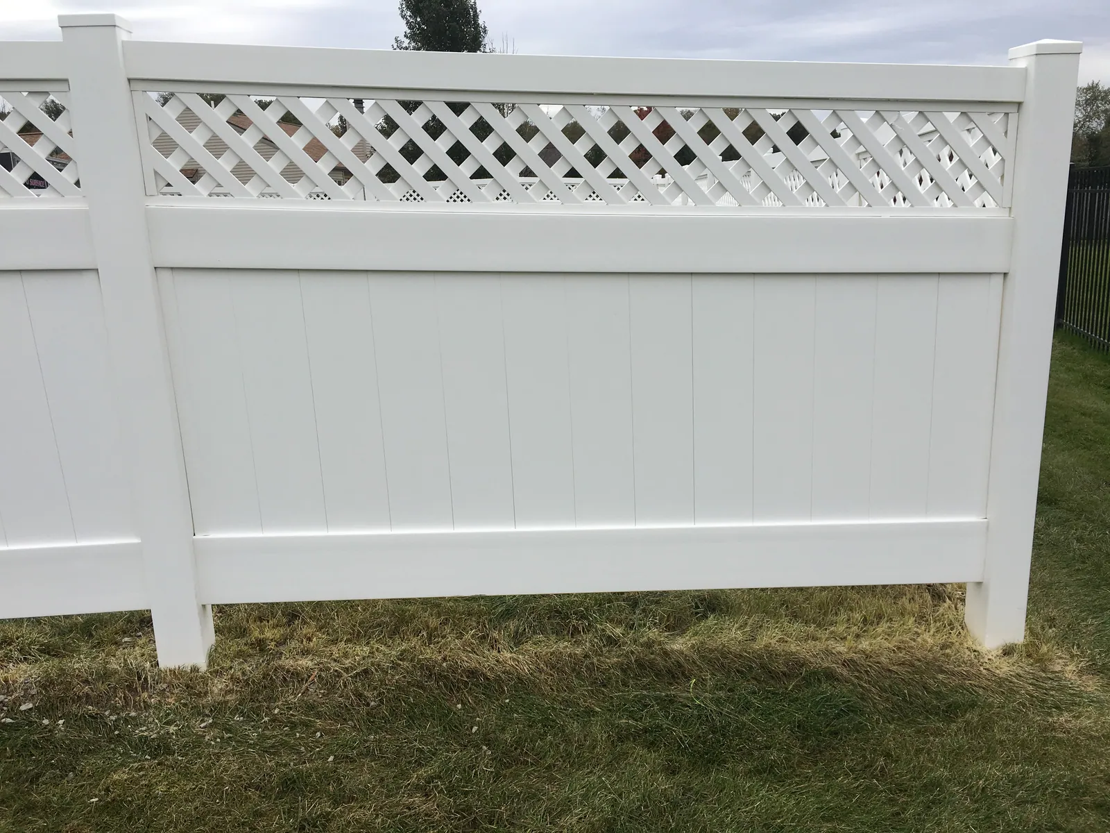White vinyl privacy fence after washing