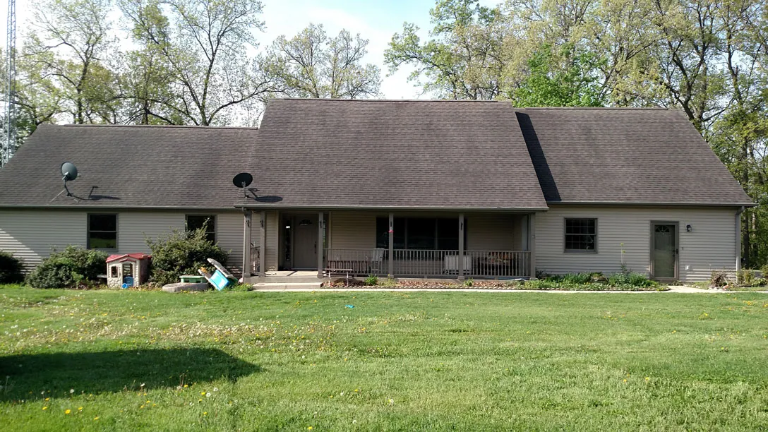 Ranch house roof with dark streaks before cleaning